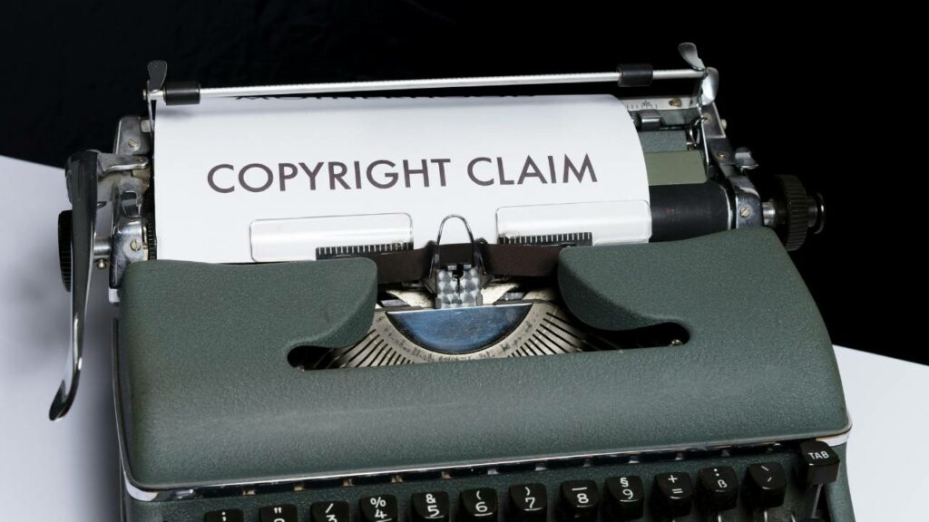 An old typewriter device with a "copyright claim" paper in it 